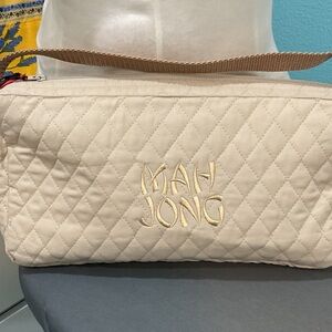Tan Quilted Mahjongg bag with gold embroidered letters.